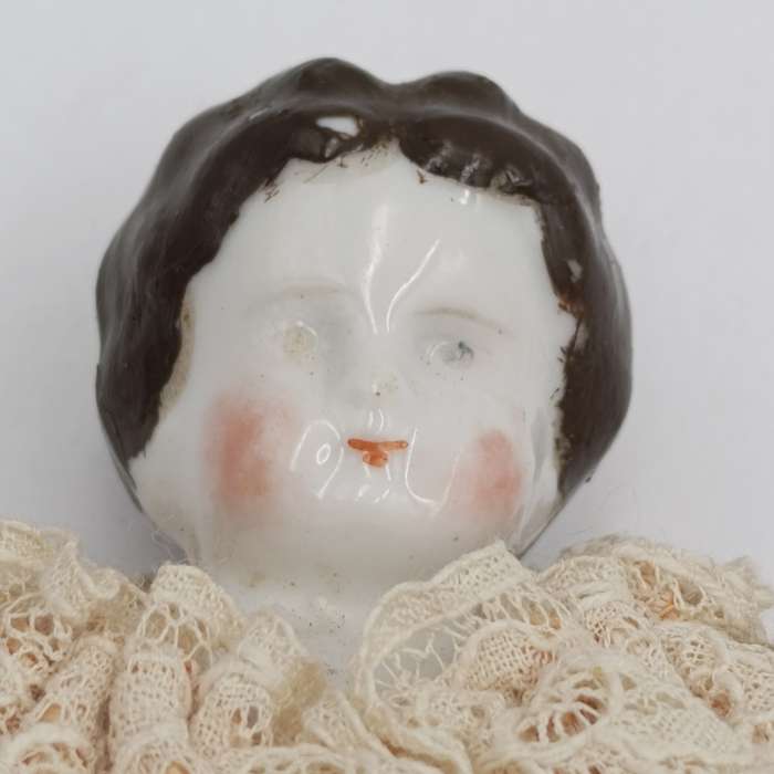Antique brown hair rosy cheeks doll - 21cm long - late 1800's
