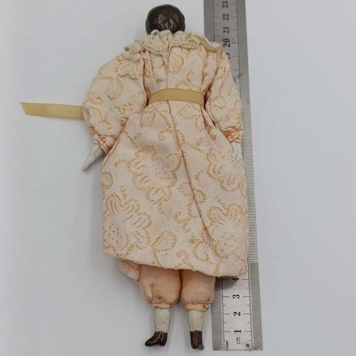 Antique brown hair rosy cheeks doll - 21cm long - late 1800's