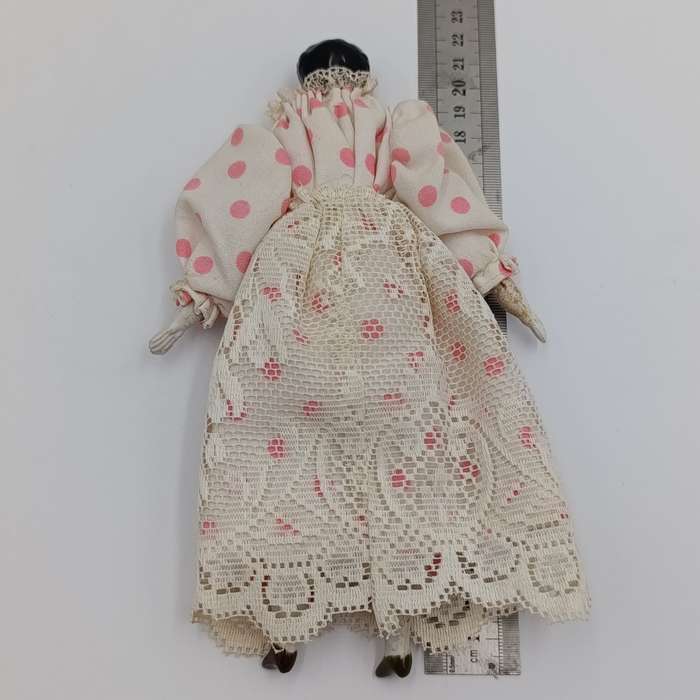 Antique blue eyes rosy cheeks dark brown hair doll - late 1800's - 21cm long