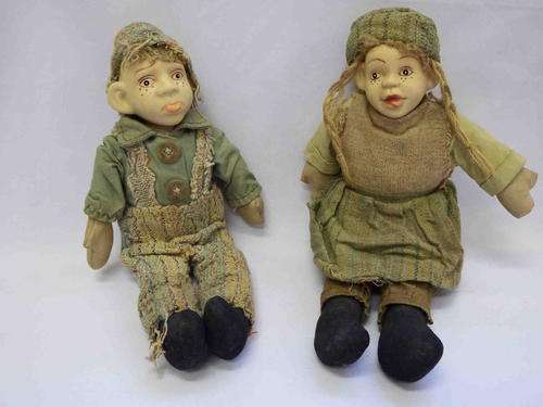 Pair of porcelain dolls from Oliver twist characters