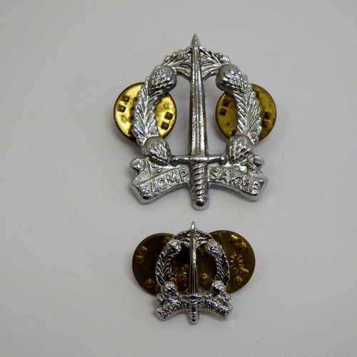 Pair of different sized military police collar badges