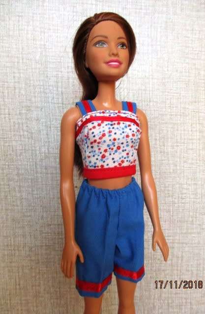 Barbie doll plus two sets of clothing - brown hair
