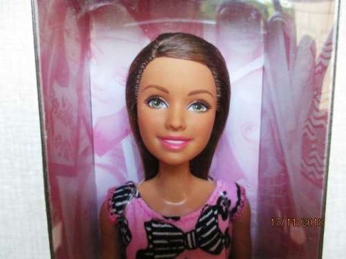 Barbie doll plus two sets of clothing - brown hair