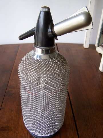 soda siphon  ... not old but very cool for your bar !!!