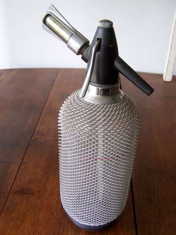 soda siphon  ... not old but very cool for your bar !!!