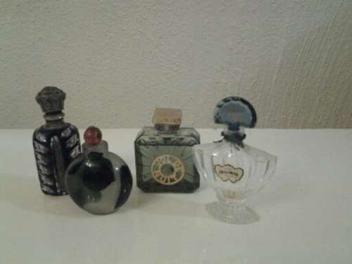 Collection of perfume bottles and one vintage smelling salts bottle please note