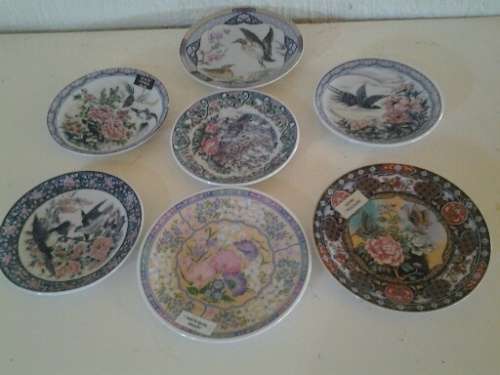 Seven pretty assorted imari small wall plates