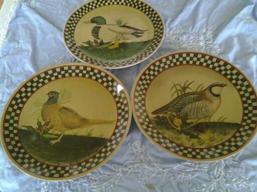 three assorted decorative pottery bird scene plates