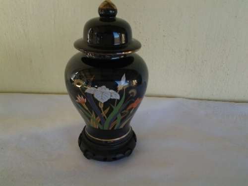 collectable decorative ginger jar on wooden stand
