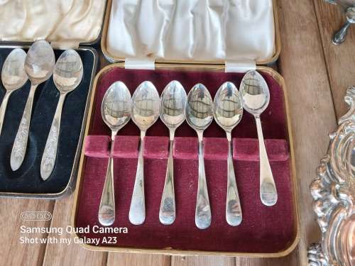 A lot of vintage sliver plated tea spoons ..tray ..tea strainer etc