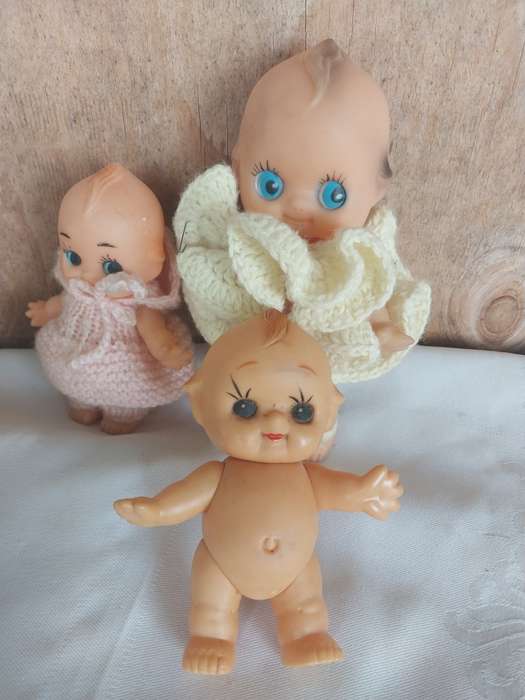 Three assorted kewpie dolls