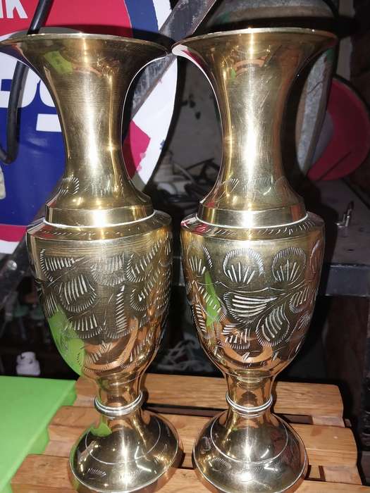 A pair of brass vases