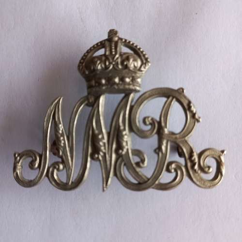 Natal Mounted Rifles Helmet badge with green backing, worn 1922 - 1943