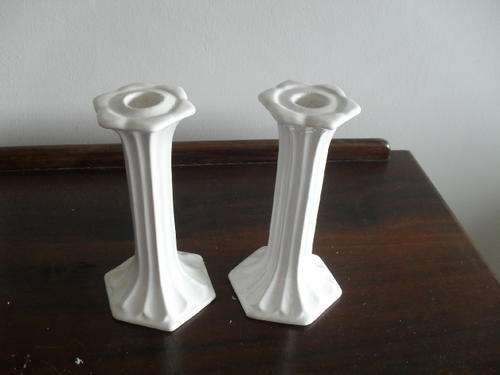 A pair of ELEGANT VINTAGE CERAMIC WHITE CANDLE STICK HOLDERS -no makers mark