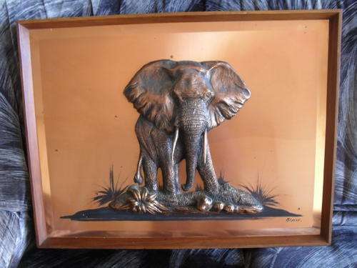 A VINTAGE COPPER 3 DIMENSIONAL ELEPHANT on a COPPER BACKGROUND.  by MICHELE -