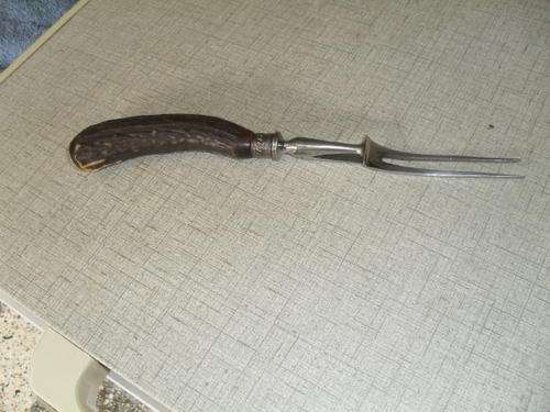 A   VINTAGE "HORN"  HANDLED CARVING FORK