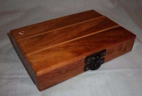 A MINI TRAVELING WOODEN CHESS SET