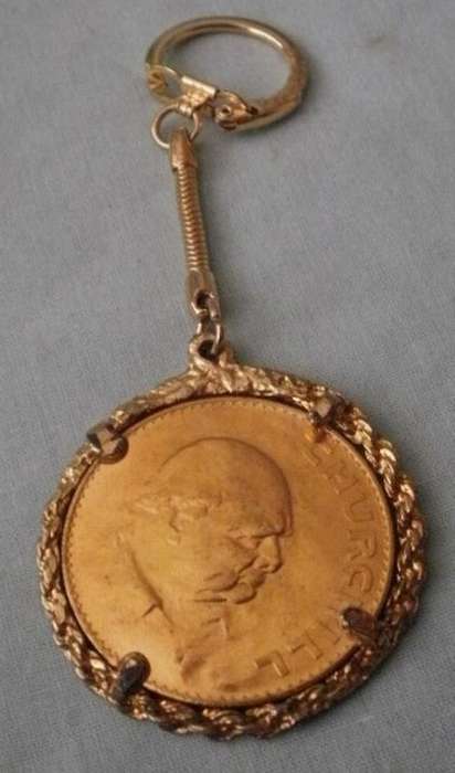 A GOLD PLATED COIN KEY RING