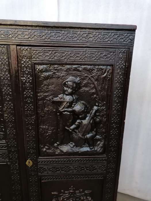 A 19th century German cabiet with beautiful Repoussè leather doors