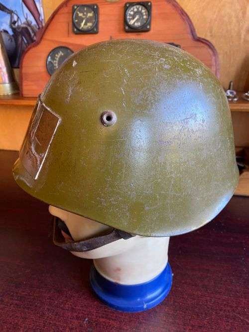 BULGARIAN M72 STEEL HELMET-USED IN ANGOLA DURING THE BORDER WAR-THERE IS A PLATE STUCK TO THE FRONT