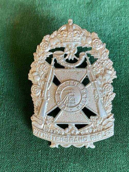 WITWATERSRAND RIFLES CAP BADGE-WORN 1913-1963- WHITE METAL- 2 LUGS