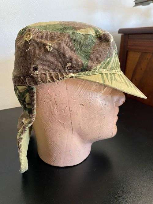 RHODESIAN CAMO FLAP CAP-SIZE 56 -USED BUT GOOD CONDITION