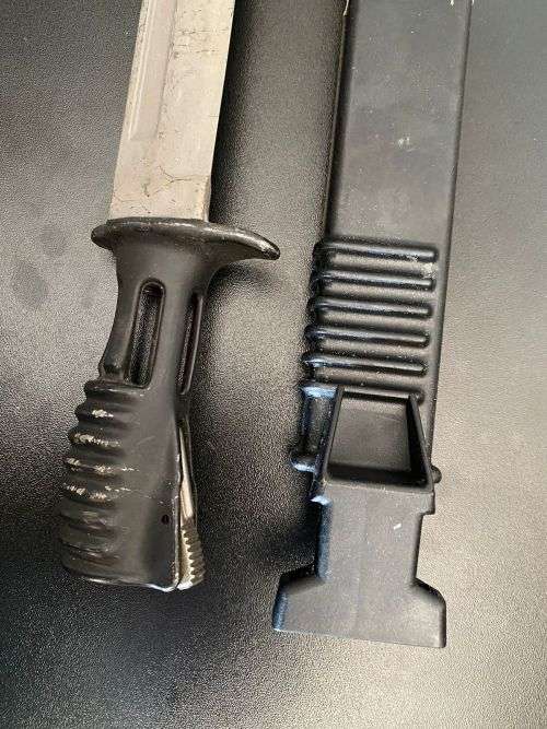 BRITISH SA 80 BAYONET-L2A1 SCABBARD WITH THE SAW EXTENDED FOR USE-THIS PRE 1986 BAYONET HAS THE EARL