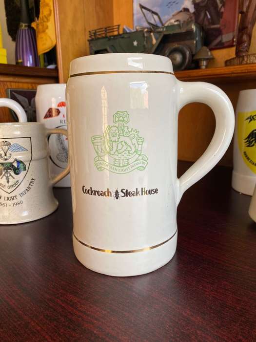 LARGE RHODESIAN LIGHT INFANTRY MUG-COCKROACH STEAK HOUSE-NORBEL POTTERIES RHODESIA,MAKERS STAMP-HEIG
