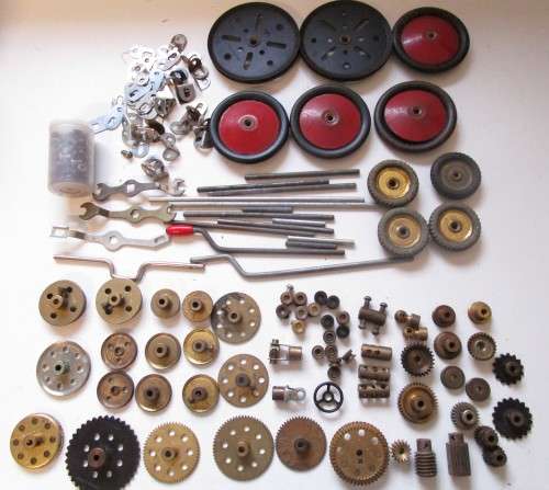 **Meccano Parts**..As per Photos.....Red/Green Parts plus Gears/Pulleys etc..Played Condition.