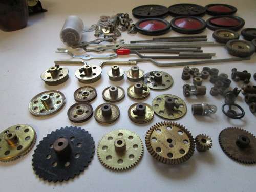 **Meccano Parts**..As per Photos.....Red/Green Parts plus Gears/Pulleys etc..Played Condition.