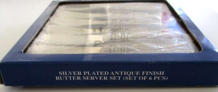 A SET OF SIX BUTTER KNIVES IN ORIGINAL UNOPENED PACKAGING