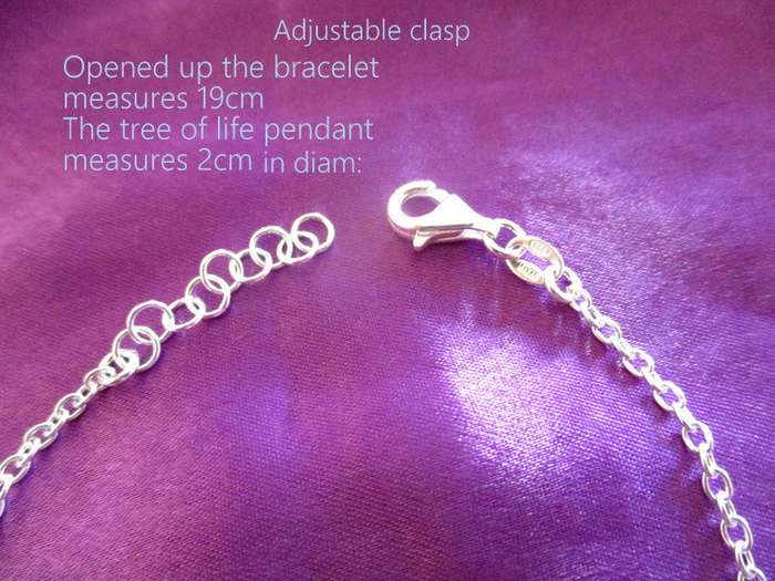 A  SOLID SILVER TREE OF LIFE BRACELET