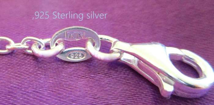 A  SOLID SILVER TREE OF LIFE BRACELET