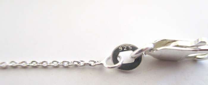 A SOLID SILVER NECKLACE WITH SILVER BALLS