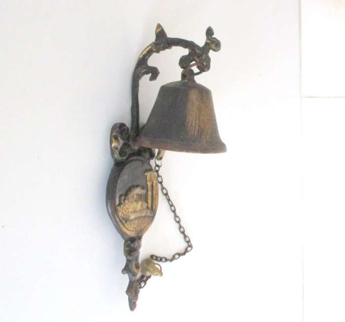 A VINTAGE METAL BELL