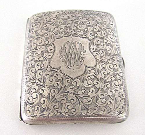 A HALLMARKED SILVER EMBOSSED CIGARETTE CASE ---67gram