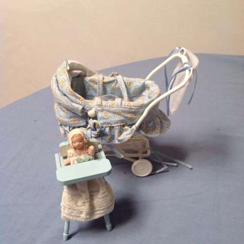 No 169. Small dolls pram and a toy highchair