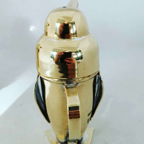 An Outstanding Gilt Novelty Art Deco Penguin Salt and Pepper Set