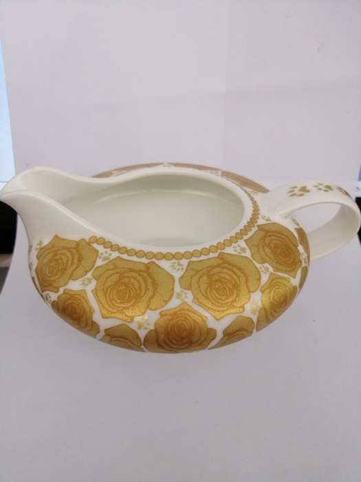 A Beautiful Jenna Clifford cream and gold milk jug.