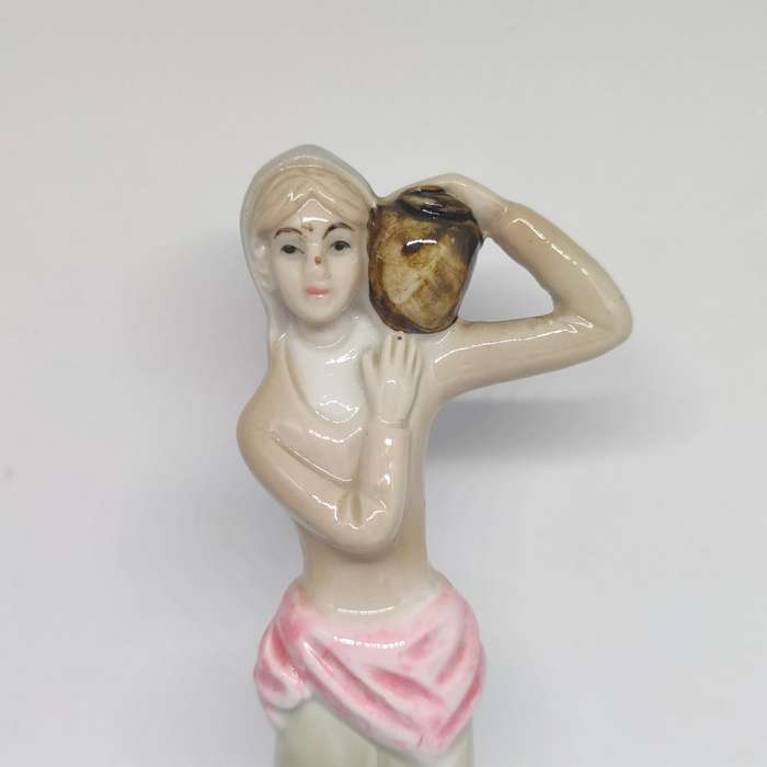 Peasant woman ceramic/porcelain figurine