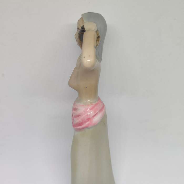 Peasant woman ceramic/porcelain figurine