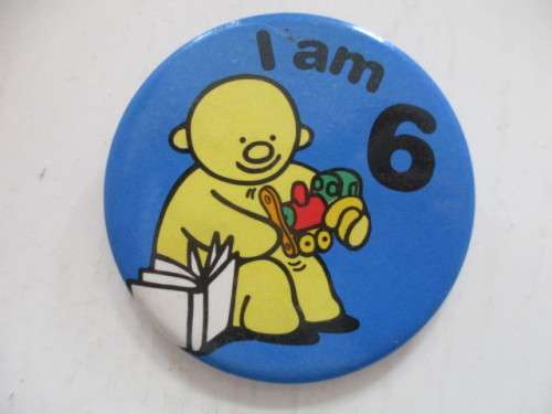 VINTAGE BASSETT CANDY  METAL BADGE