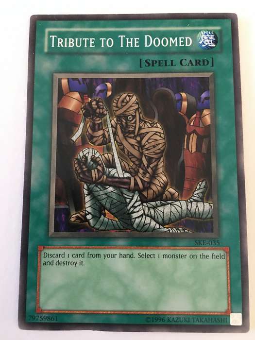 YU-GI-OH TRADING CARD - TRIBUTE TO THE DOOMED