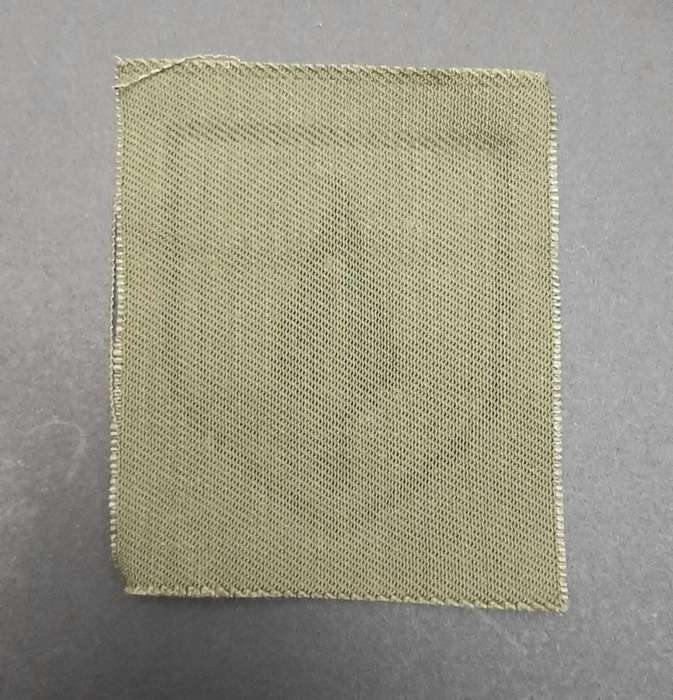 **Rhodesian Bush War: 1970s Pfumo Re Vhanu Green Auxiliary Cap Badge (UNISSUED**