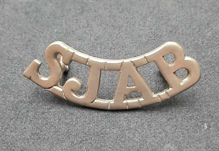 **WW2 St. John Ambulance White Metal Shoulder Title (Lugs Intact).**