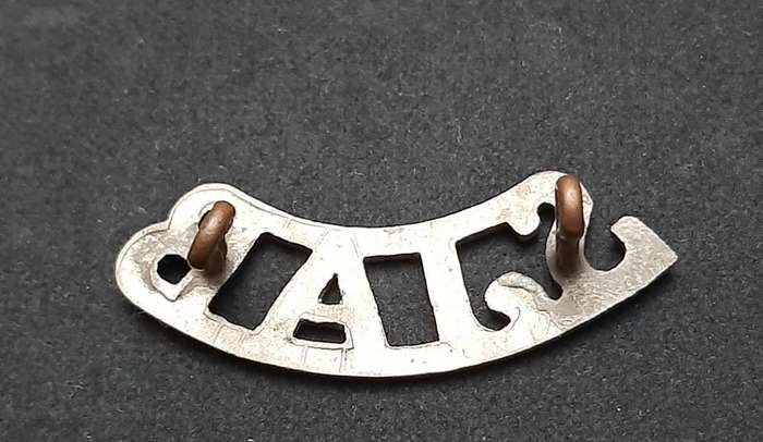 **WW2 St. John Ambulance White Metal Shoulder Title (Lugs Intact).**