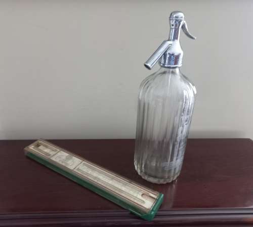 OLD PROTRACTOR AND BOTTLE
