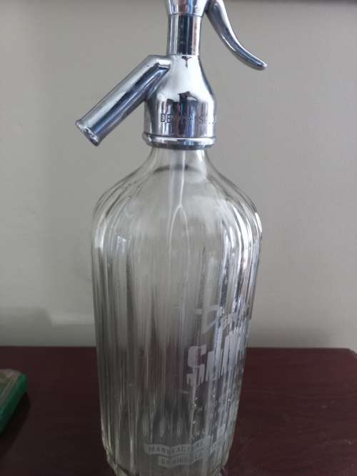 OLD PROTRACTOR AND BOTTLE