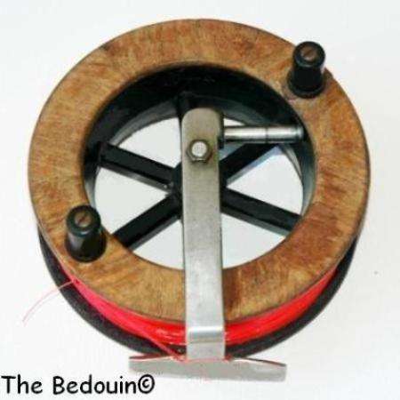 SCARBOROUGH FISHING REEL. Wood finish. 14 cm diameter. 4 cm width. (Casting & reeling)