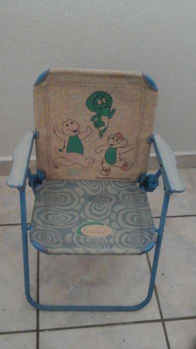 WELL LOVED AND FADED WITH AGE HIGHLY COLLECTIBLE A BARNEY KIDDIES FOLD UP CHAIR.